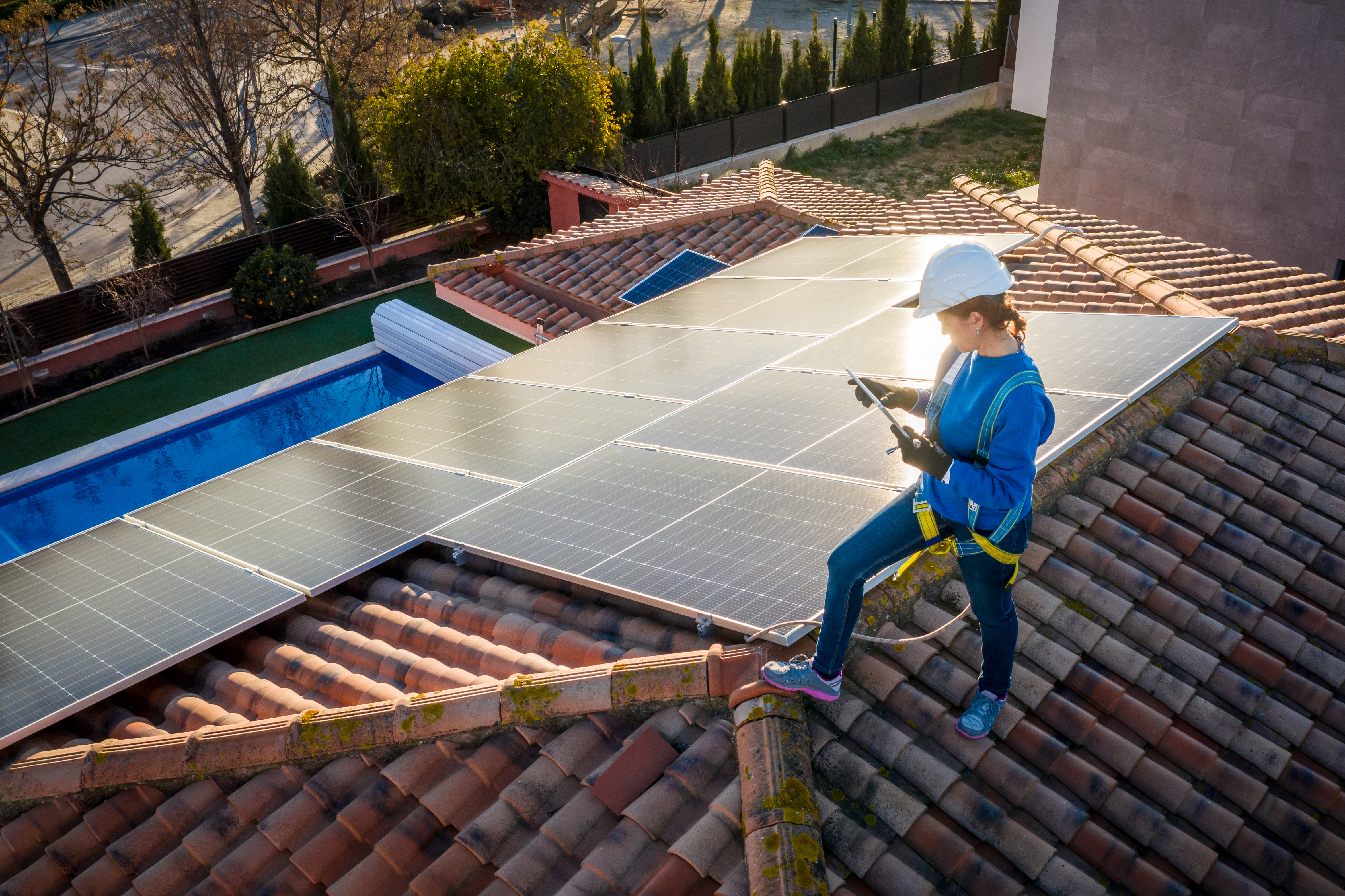 woman installing solar panel