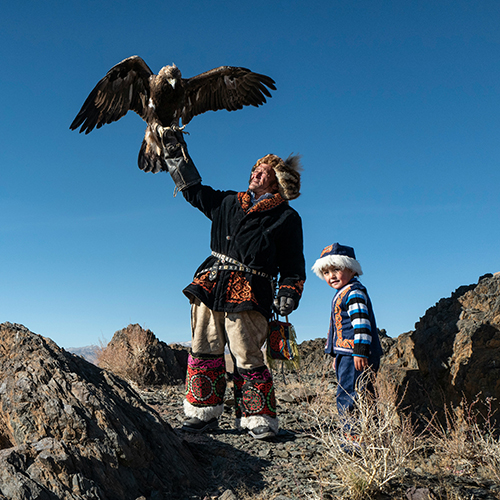 mongolian man holding eagle