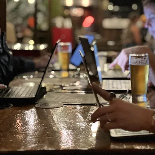 changemakers work over drinks