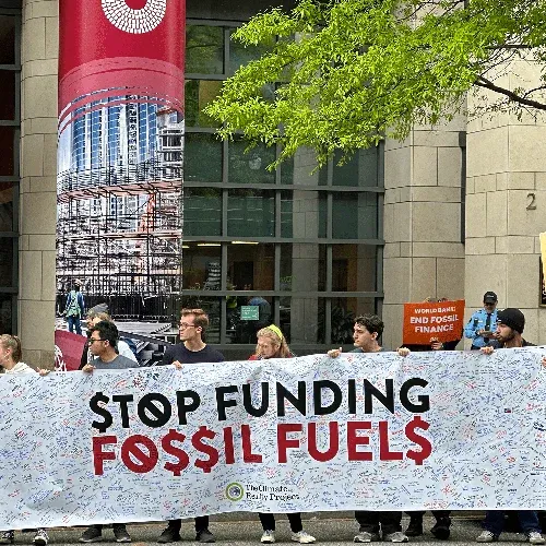 people with signs at a climate rally