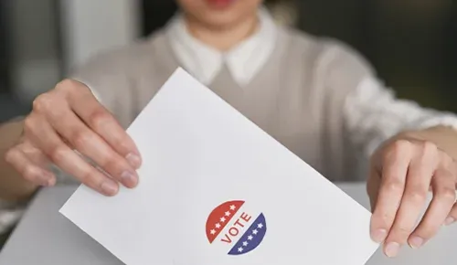 person holding ballot