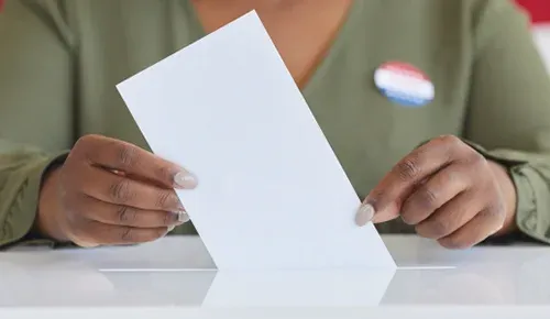 person holding ballot