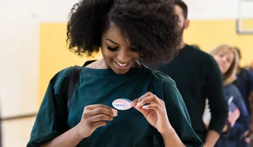 woman holding sticker