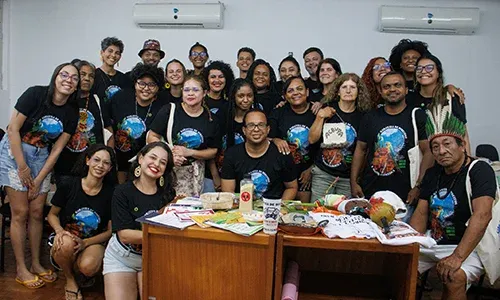 group photo of brazilian climate leaders sitting at a table