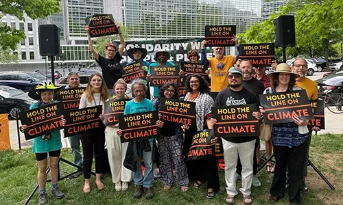 activists with signs at the world bank