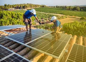 Workers installing a solar panel