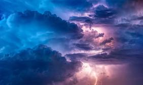 Lightning inside multicolored clouds