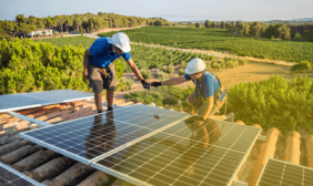workers installing solar panels