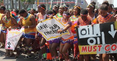 People Holding anti-oil sign