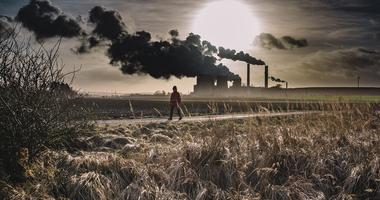 Person walking near a power plant