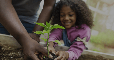 Child planting flower