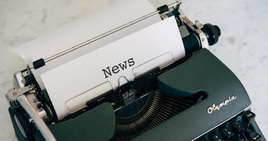 Typewriter with the word news on a piece of paper
