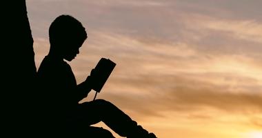 Child Reading a Book