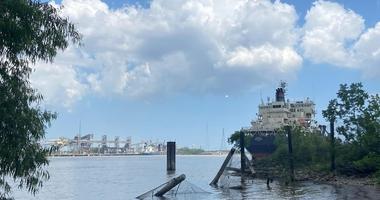 Benzine warning and boat in Mississippi River