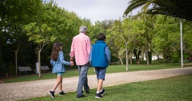 older adults going for a walk in a park