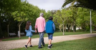 older adults going for a walk in a park