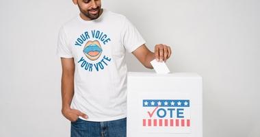 Person puts ballot in ballot box 