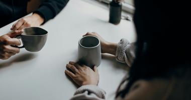 conversation happening in a cafe