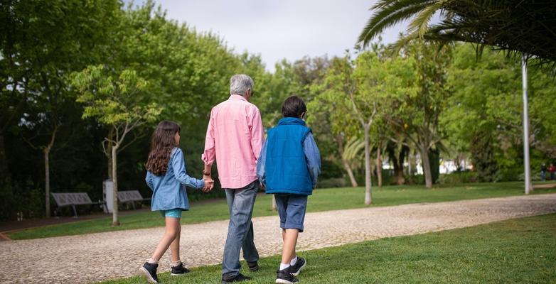 older adults going for a walk in a park
