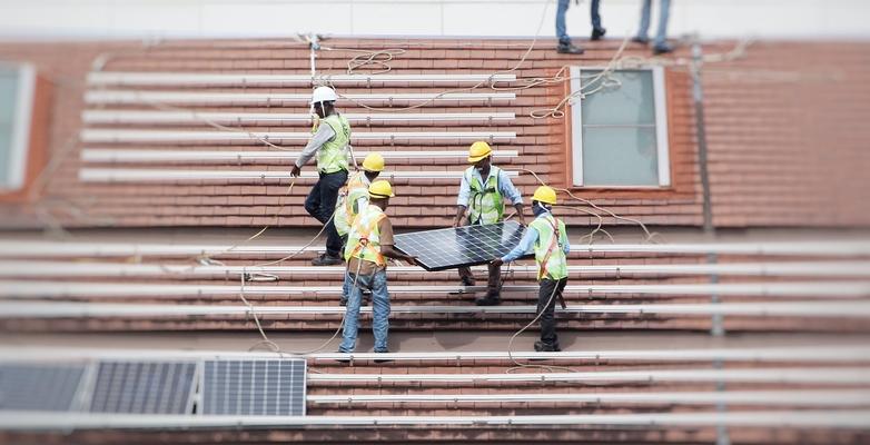 people installing solar panels