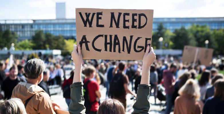 climate protest we need a change sign