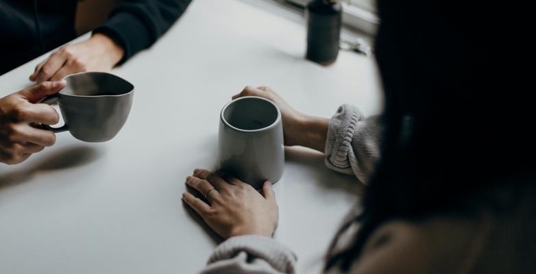 conversation happening in a cafe